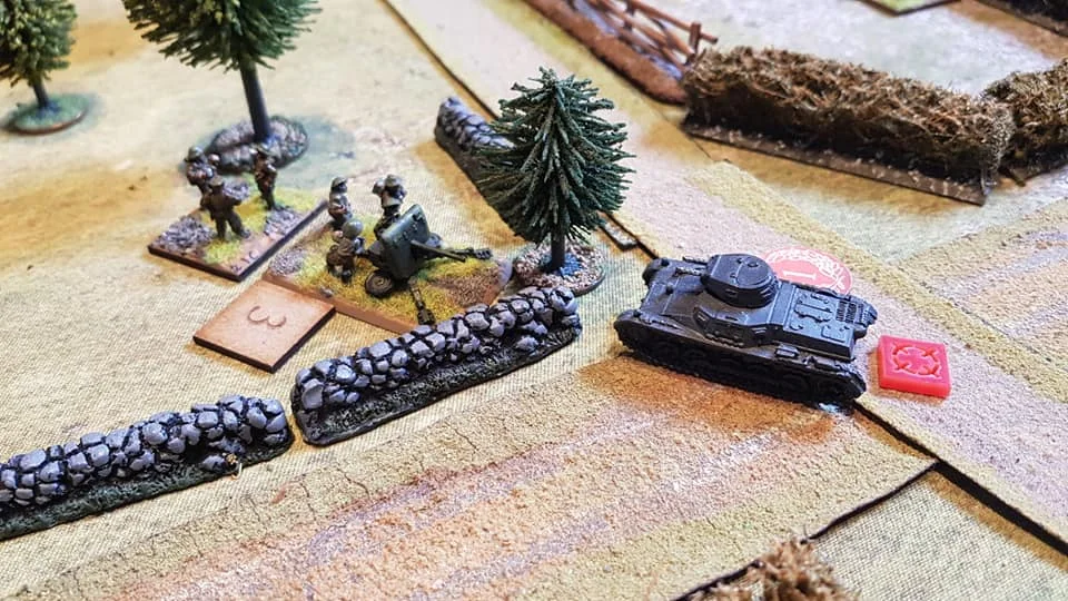 Despite knocking out one tank, the second AFV has its gun damaged but tries to overrun the 2pdr, but is halted by the AT crew just feet from the gun. A last minute reprieve but it blocks the gun's view.