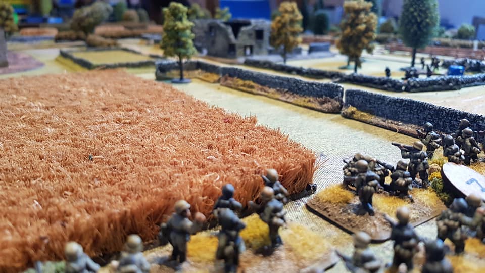  The view from the German left flank. The advancing Germans think they only have the HMG top right to deal with, but are unaware another 2pdr waits in the walled field (top left) and two sections in the farm (top left, not shown) and are about to nai