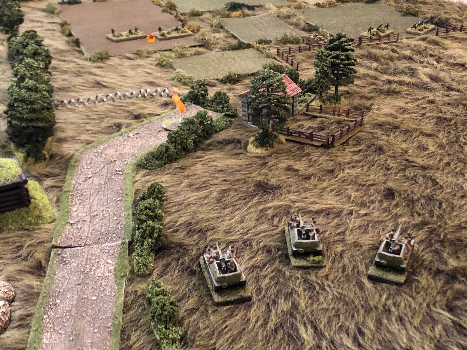 Vehicle 3 spots German infantry of 2nd Company's 3rd Platoon (top left) and opens fire, knocking one squad out and pinning the other!