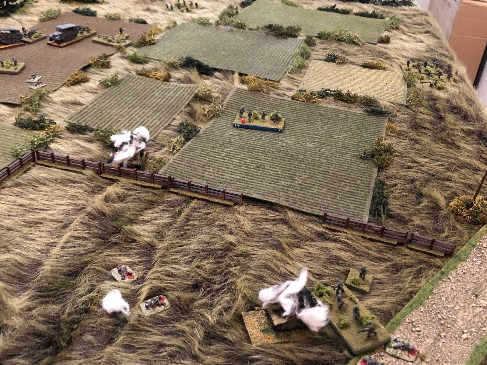 The point blank HE fire knocks out one German squad (bottom left)...
