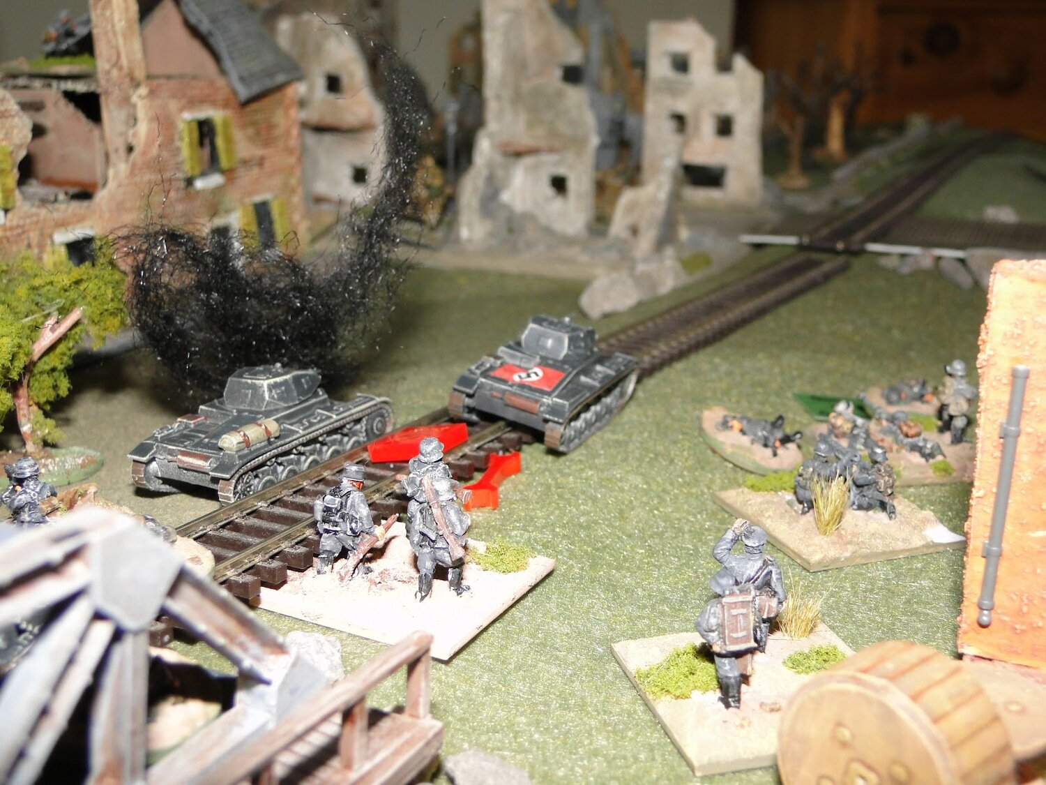  Hauptman Kliesche pushes the antitank rifle team forward behind the cover of the railway embankment. From there they take potshots at the French tanks panicking one which pulls back. 
