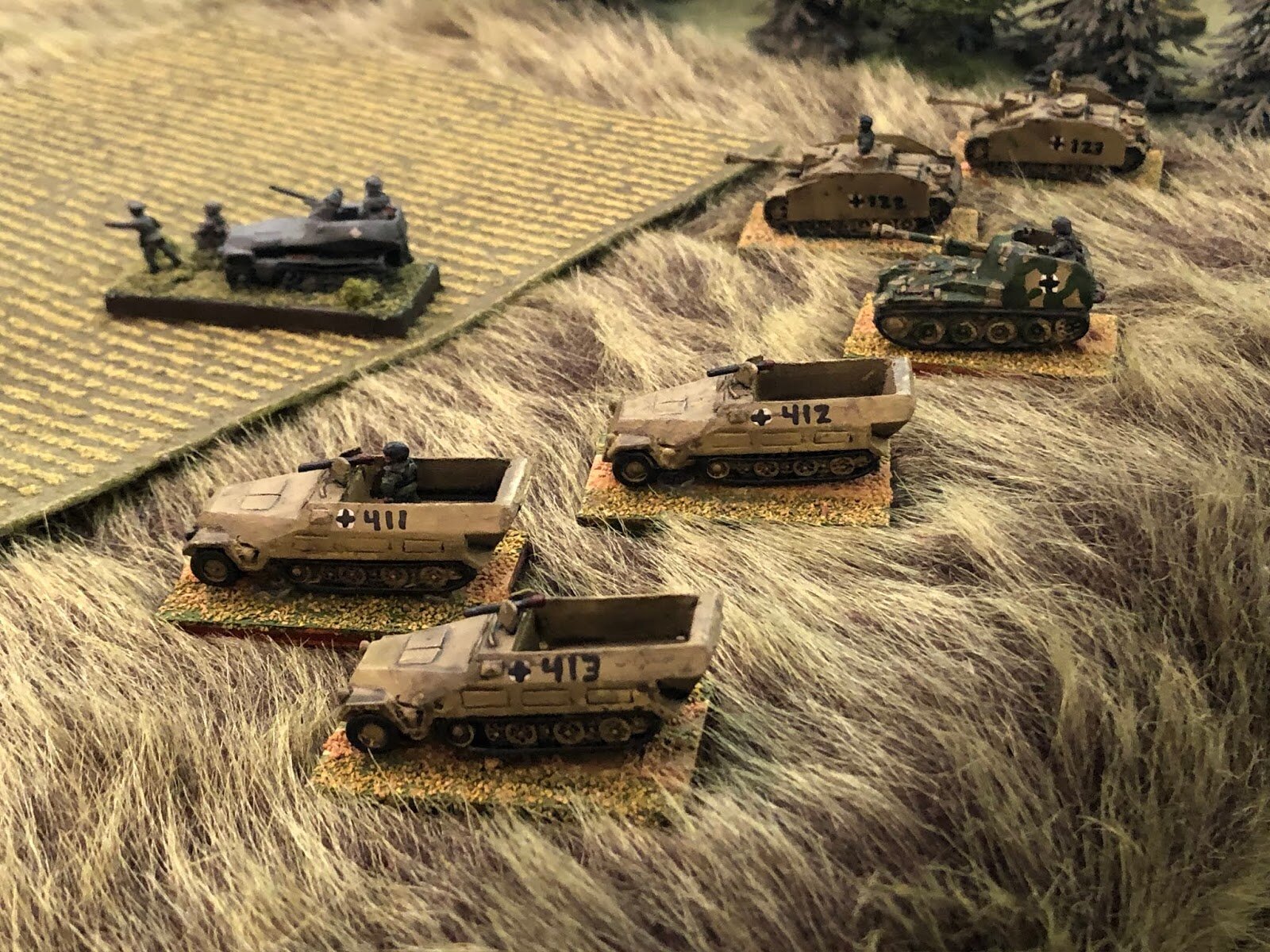 The German CO (top left) is leading up two Stugs and a Marder, as well as three halftracks carrying three squads of REMFs. The time for battle is upon us! 
