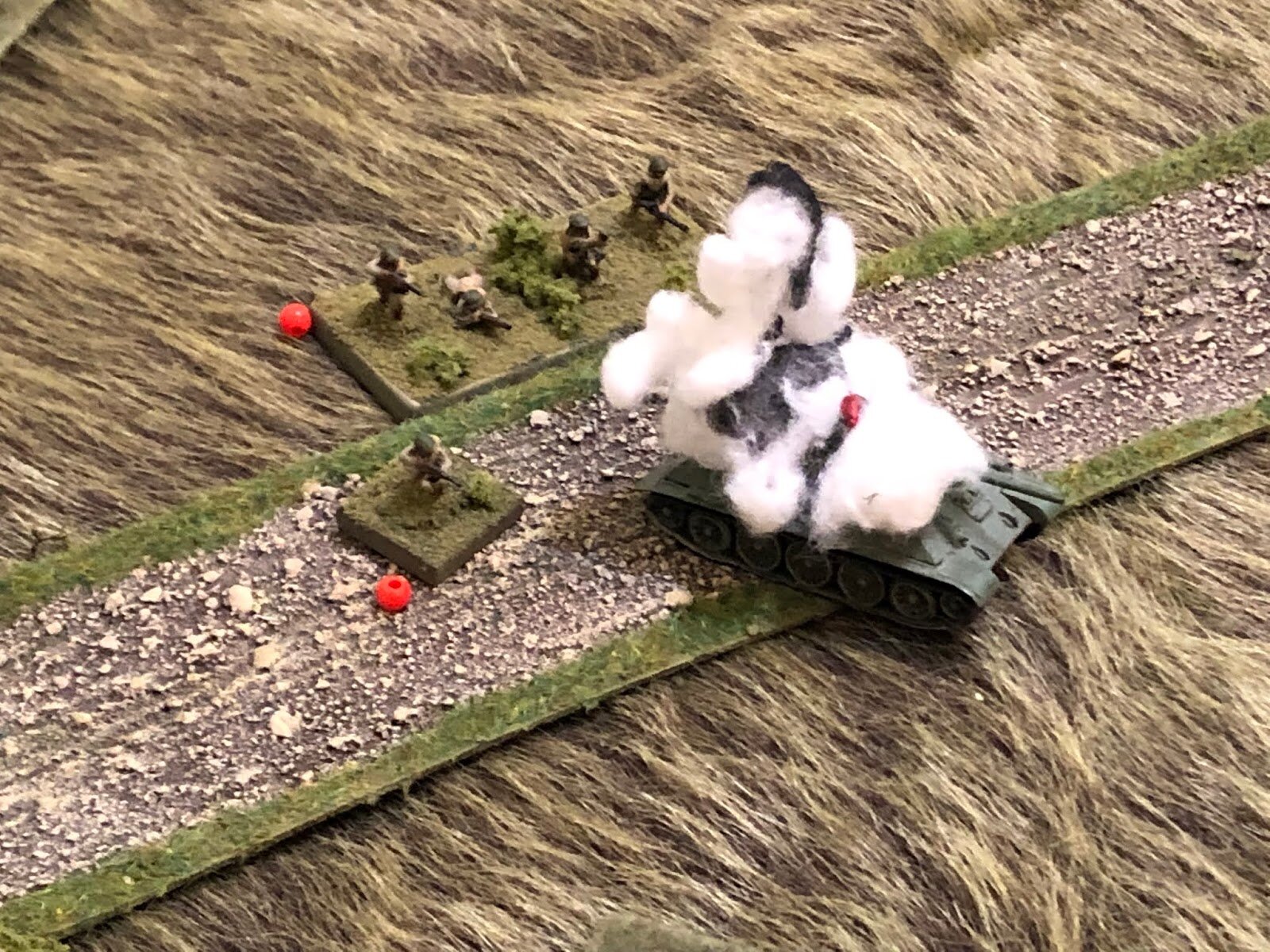  The T-34 is penetrated and knocked out, the infantry PC and riflemen jumping off, dazed.  