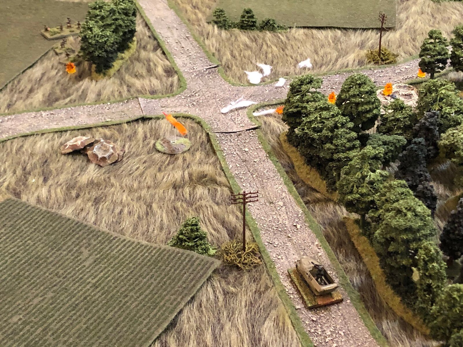  Nearing the objective, the German halftrack PC (bottom right) spots the Soviet 2nd Rifle Platoon (top left, with the German defenders at top right) and opens fire with their MG-42, to no effect.  *Ha, I'm a knucklehead! I left a stack of craters lyi
