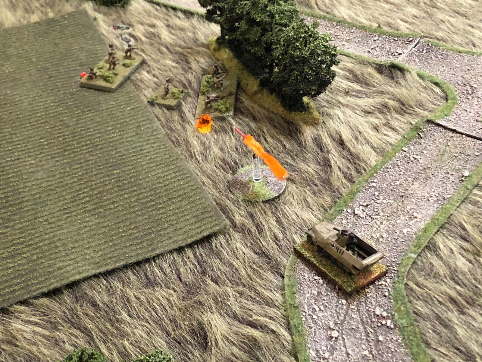  The halftrack's MG continues spewing lead... 
