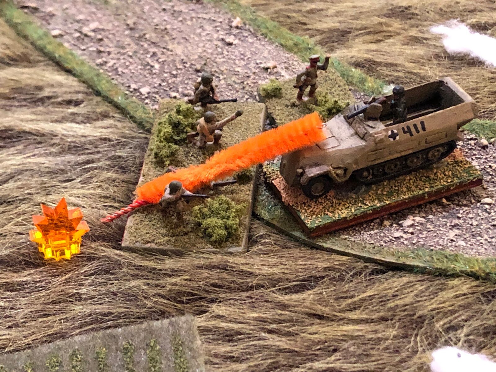  They dodge defensive fire from the German machine gun, clamoring up onto the steel beast, firing at point blank range and tossing hand grenades... 