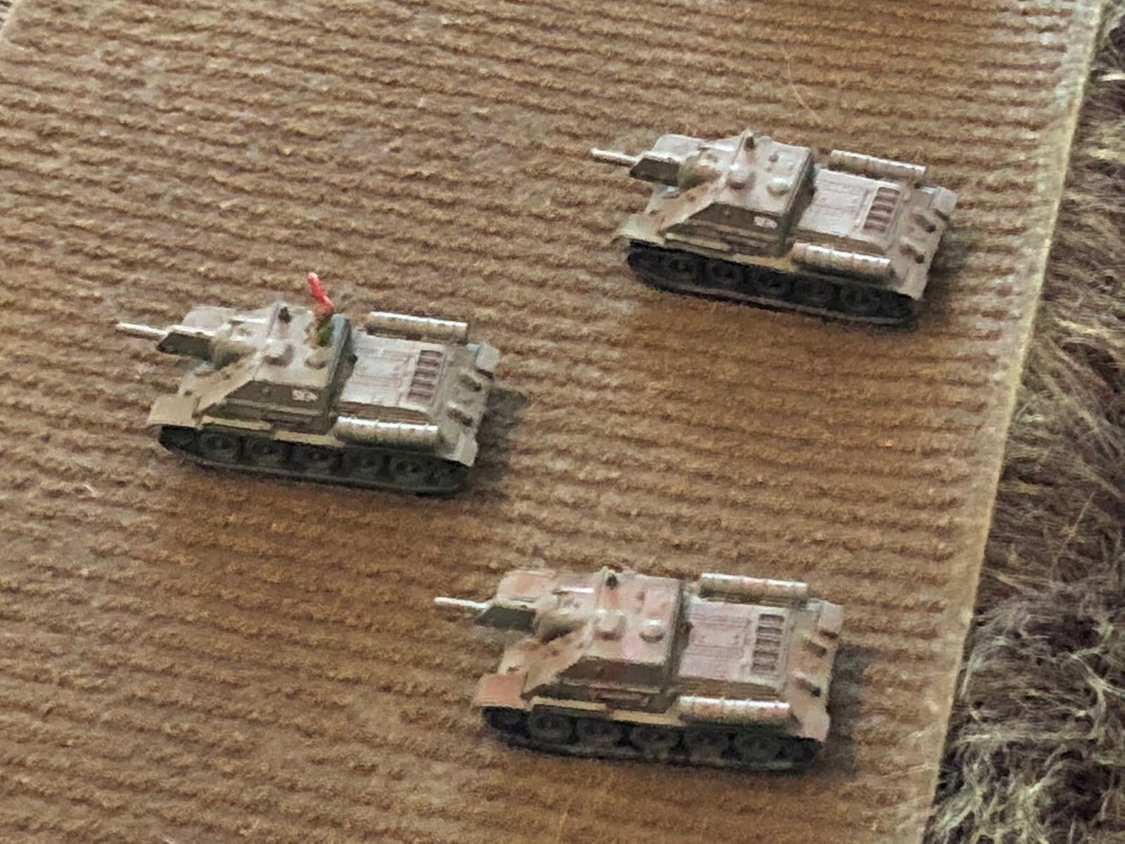  My Su-122s, from Takara, the PC with a crew figure from Pendraken.  I don't think I've ever actually had these on the wargaming table. 