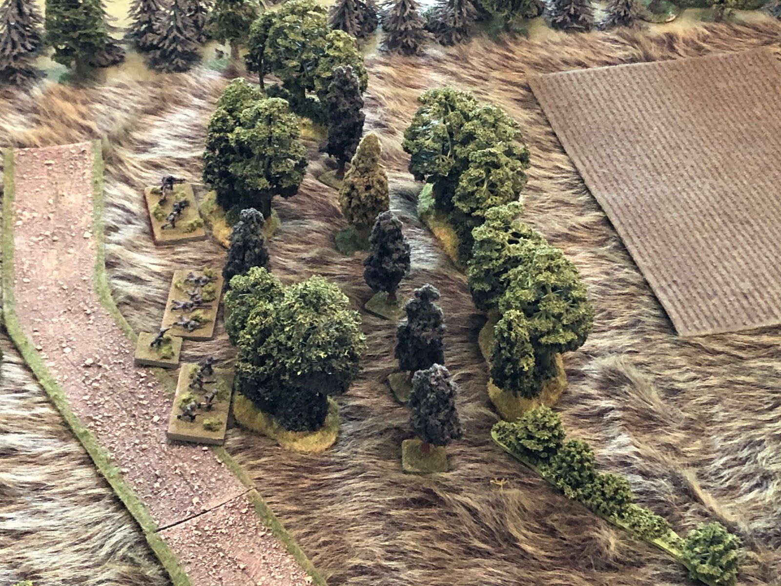  1st Platoon in the North Wood.  This is a hasty defense, so no one is dug in, just hasty scrapes making the best use of terrain.  You can see what I was talking about with the 'reveres-slope' defense concept; the Soviets will have to come through, o