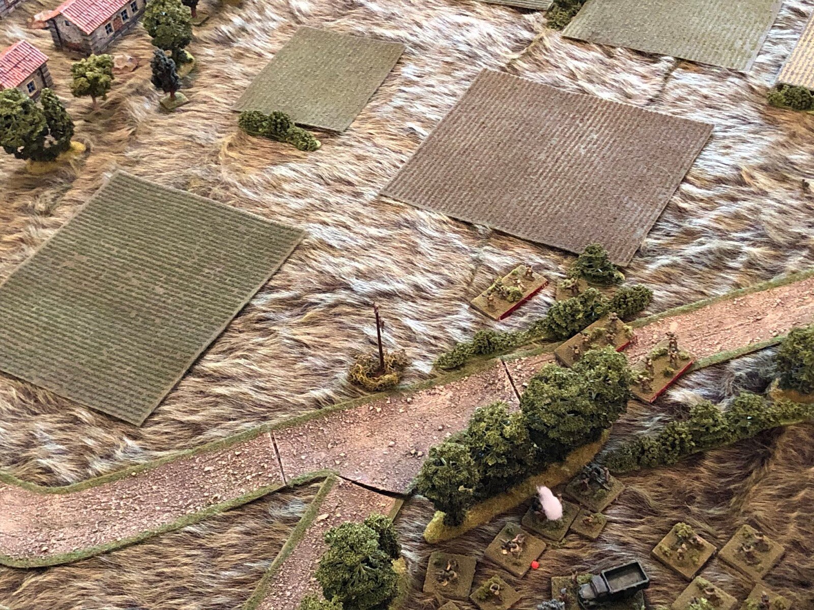  While in the center, the Soviet 3rd Platoon steps off (center) for Snava (top left), as the Soviet CO rallies the MG Platoon (bottom center).   And then Turn 1 ends. Kinda wild that, with all that Soviet armor on the table, the only one that moved w