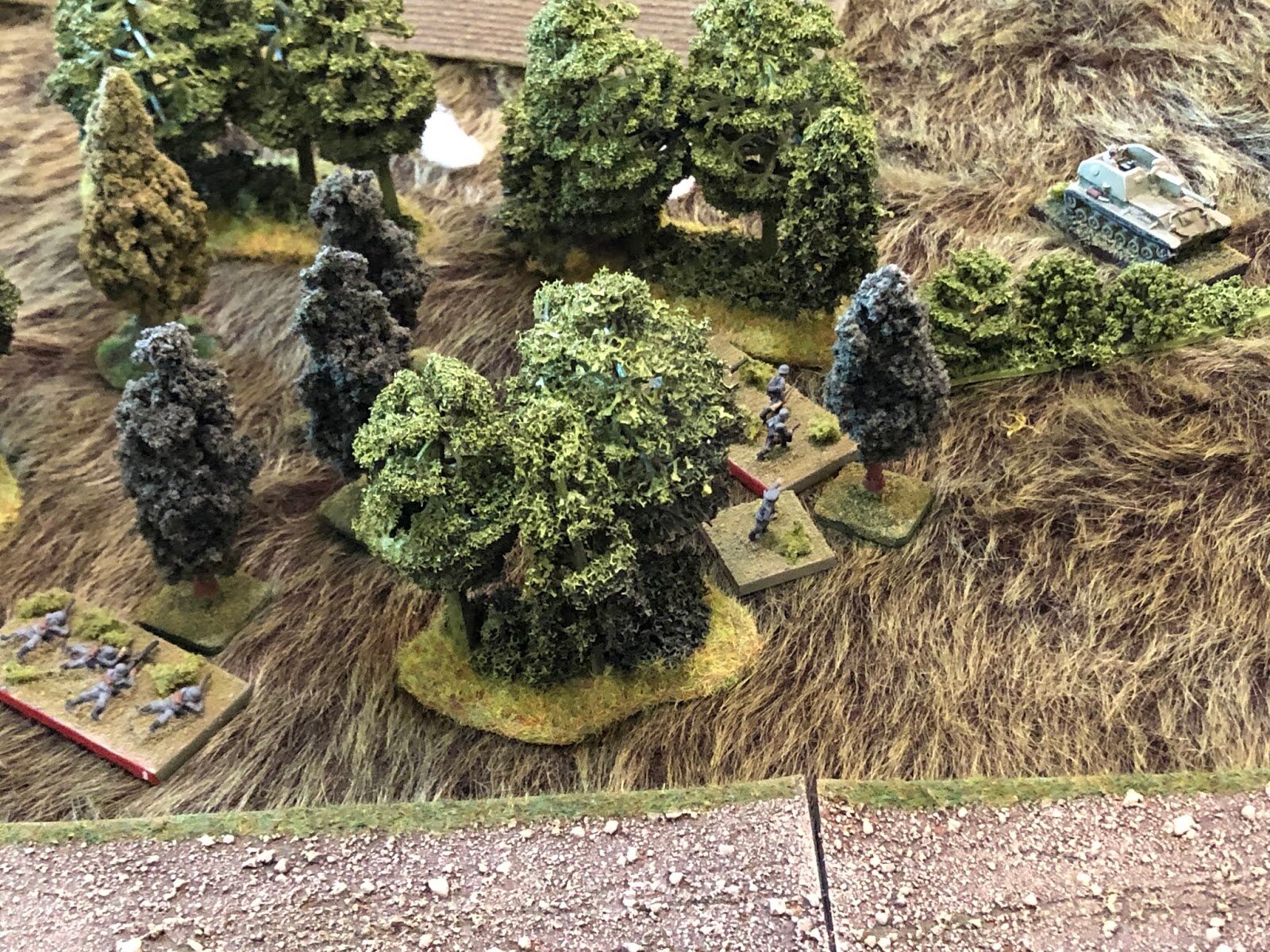  On the German far left, 2nd Squad, 1st Platoon (bottom left) watches as their Platoon Commander grabs 3rd Squad moves forward (center), stalking the Soviet Su-76 Platoon Commander (top right), taking advantage of the fact the Soviet Tank Riders (off