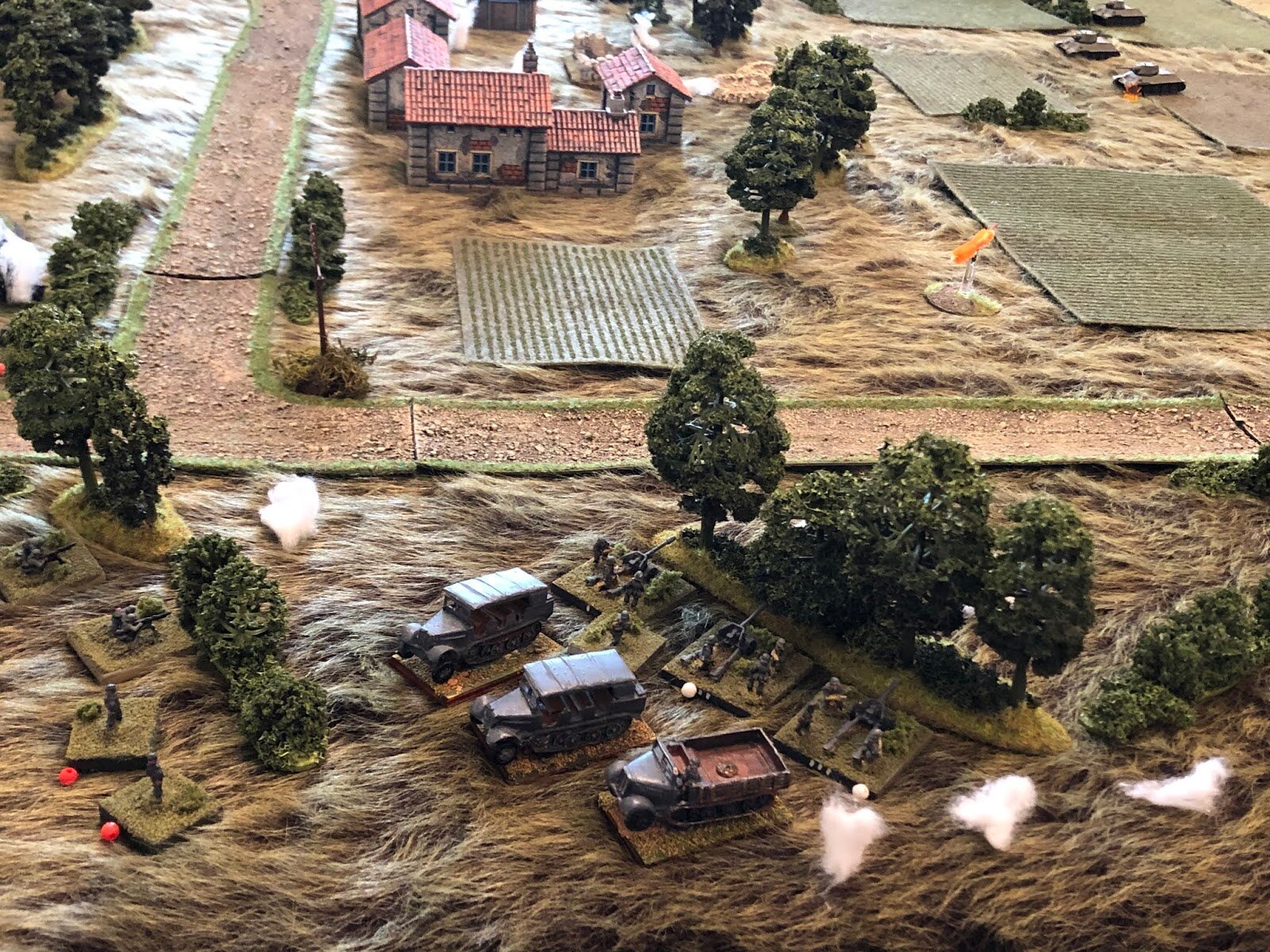  In the German ATG position, as much as he curses and cajoles, the Platoon Commander can't get the cowardly gun crews that ran to rally (bottom left), but Gun #1 hangs in there and keeps firing, sighting in on one of the T-34s from 1st Tank Platoon (