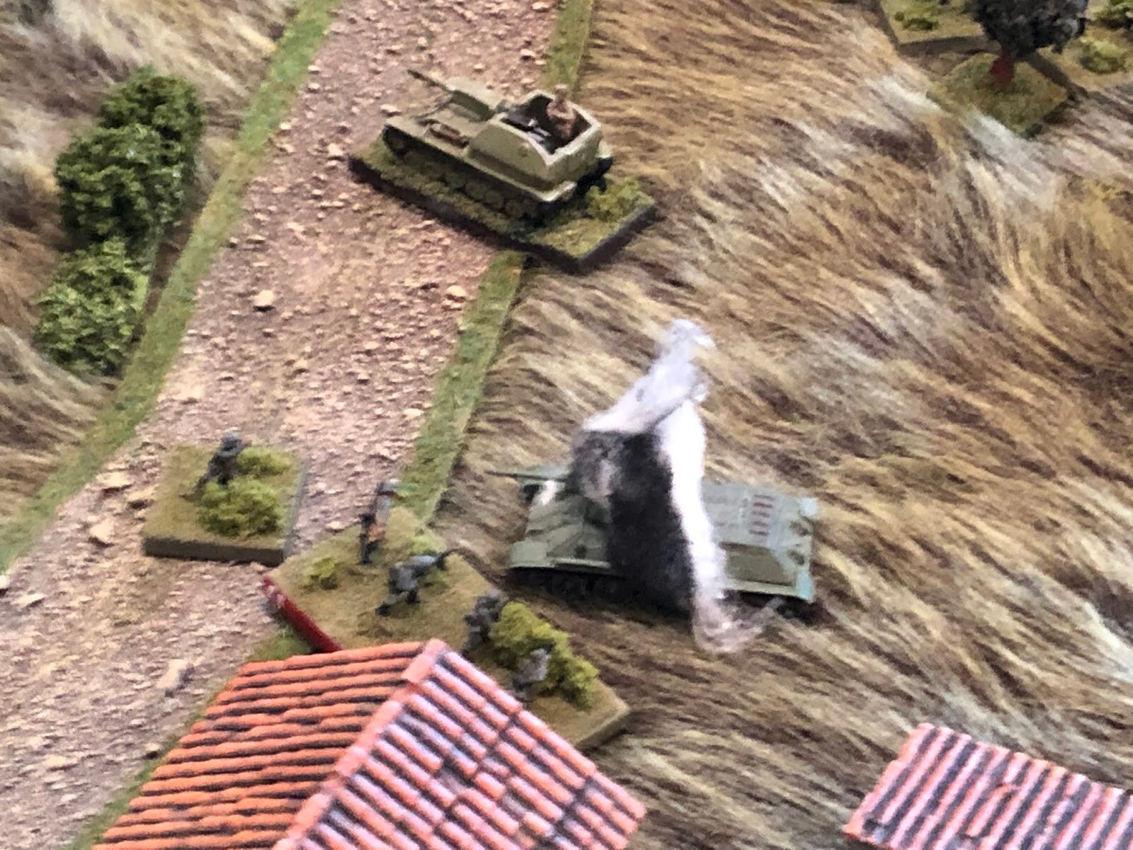  The T-34's back deck catches fire and several internal explosions are heard as the turret slews left and smoke belches forth from its hatches! 