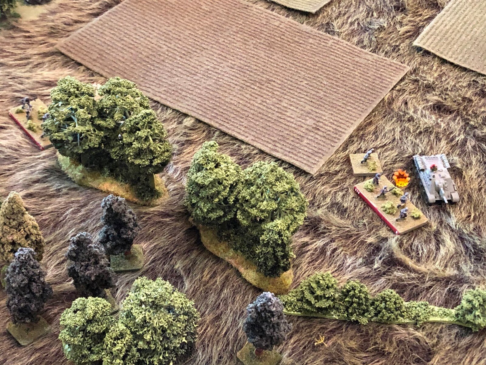  And while the melee was occurring (top left), the German 1st Platoon Commander and his 3rd Squad broke cover and charged out into the flank of the Soviet Su-122 Platoon Commander (far right, from center)! 