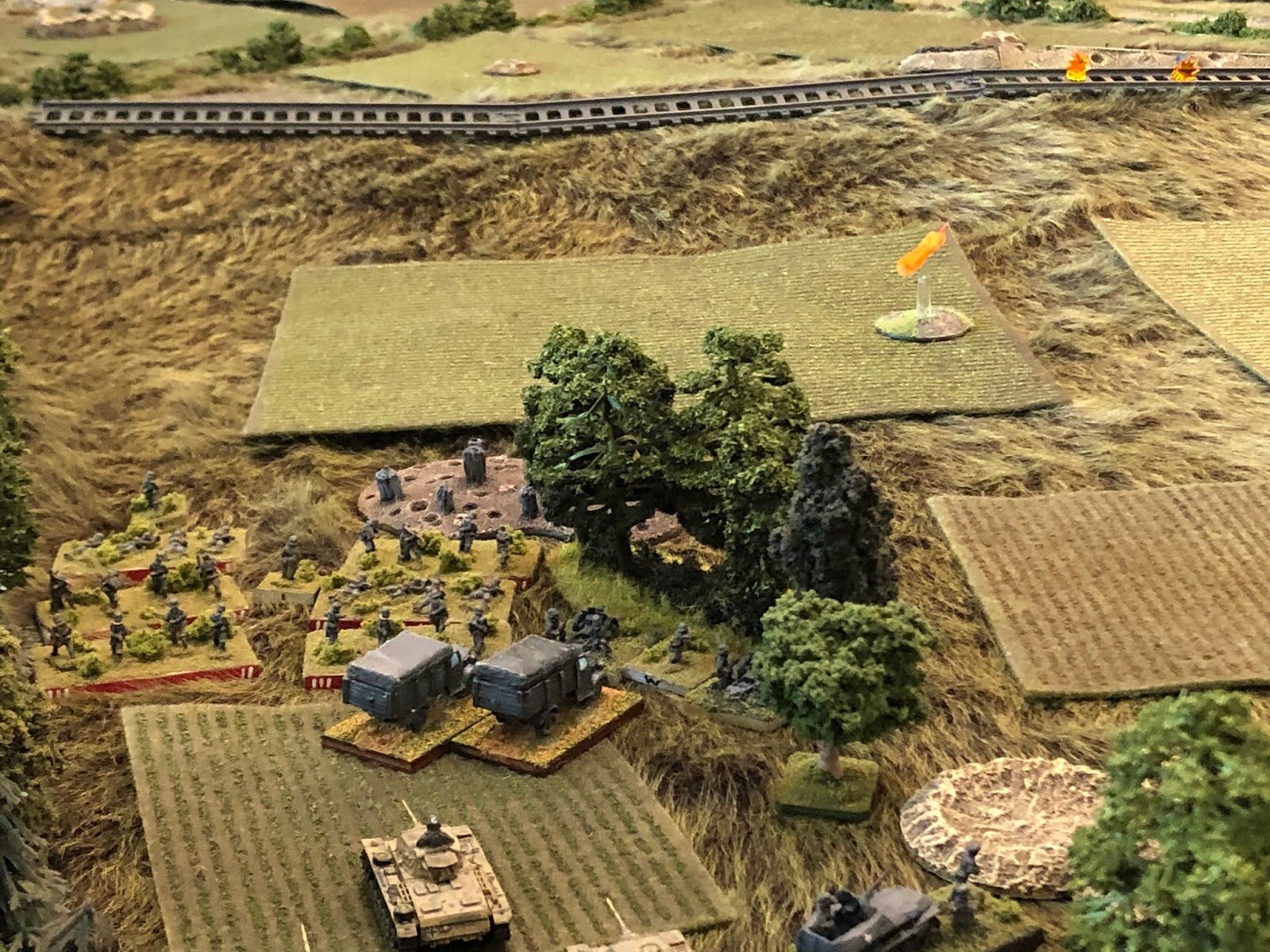  And the Infantry Guns begin pounding the railway embankment.   Penalty flag! This is violating their rules of engagement! 1st Company's assault on the southwest woods was supposed to have priority of fire! This is what happens when you split your fo