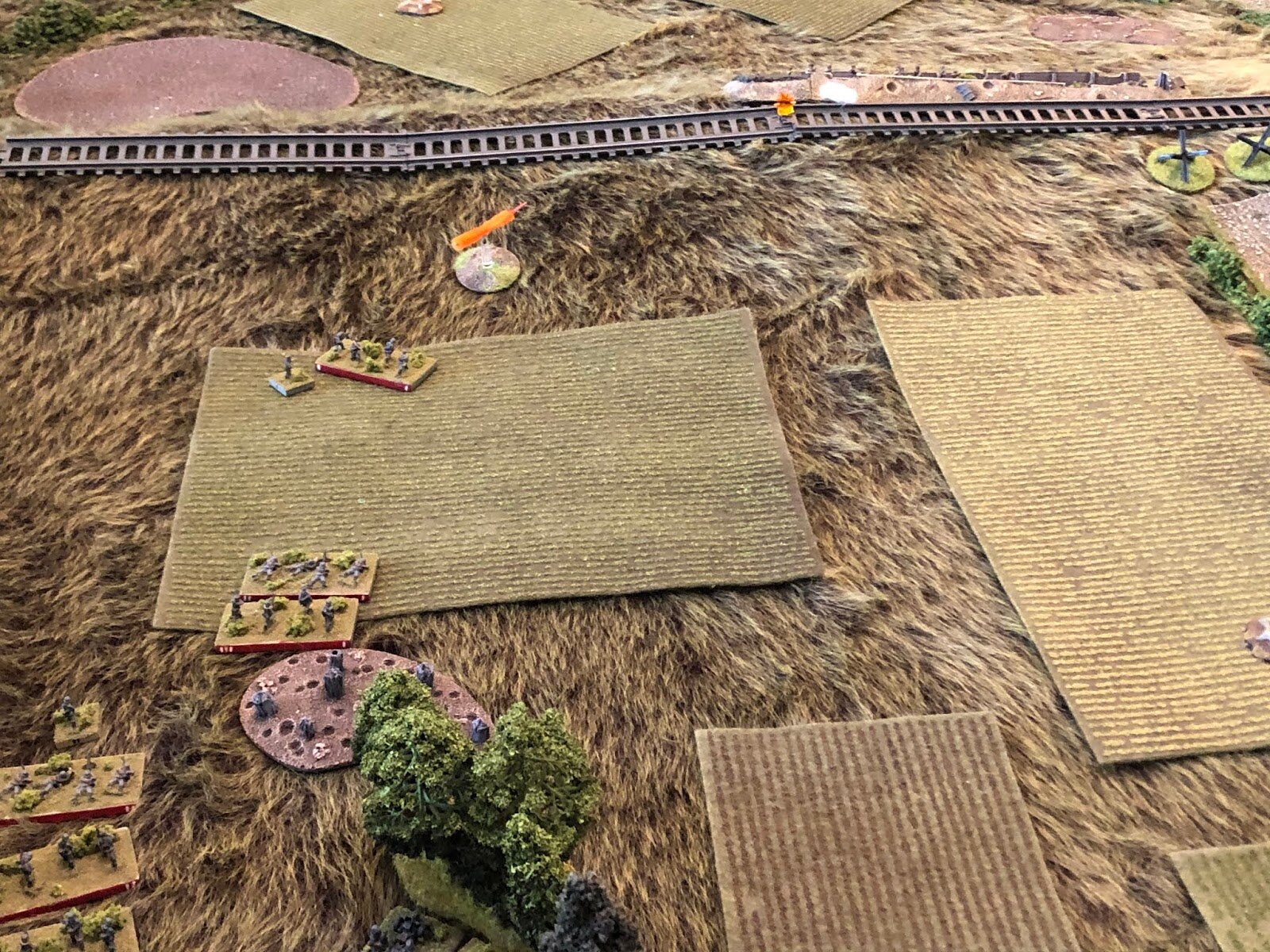  On the German left, 2nd Platoon, 2nd Company gets moving, with their Platoon Commander grabbing his 1st Squad (left top) and pushing them forward, where they peer up to the lip of the railway embankment.  They spot several helmets and open fire, but