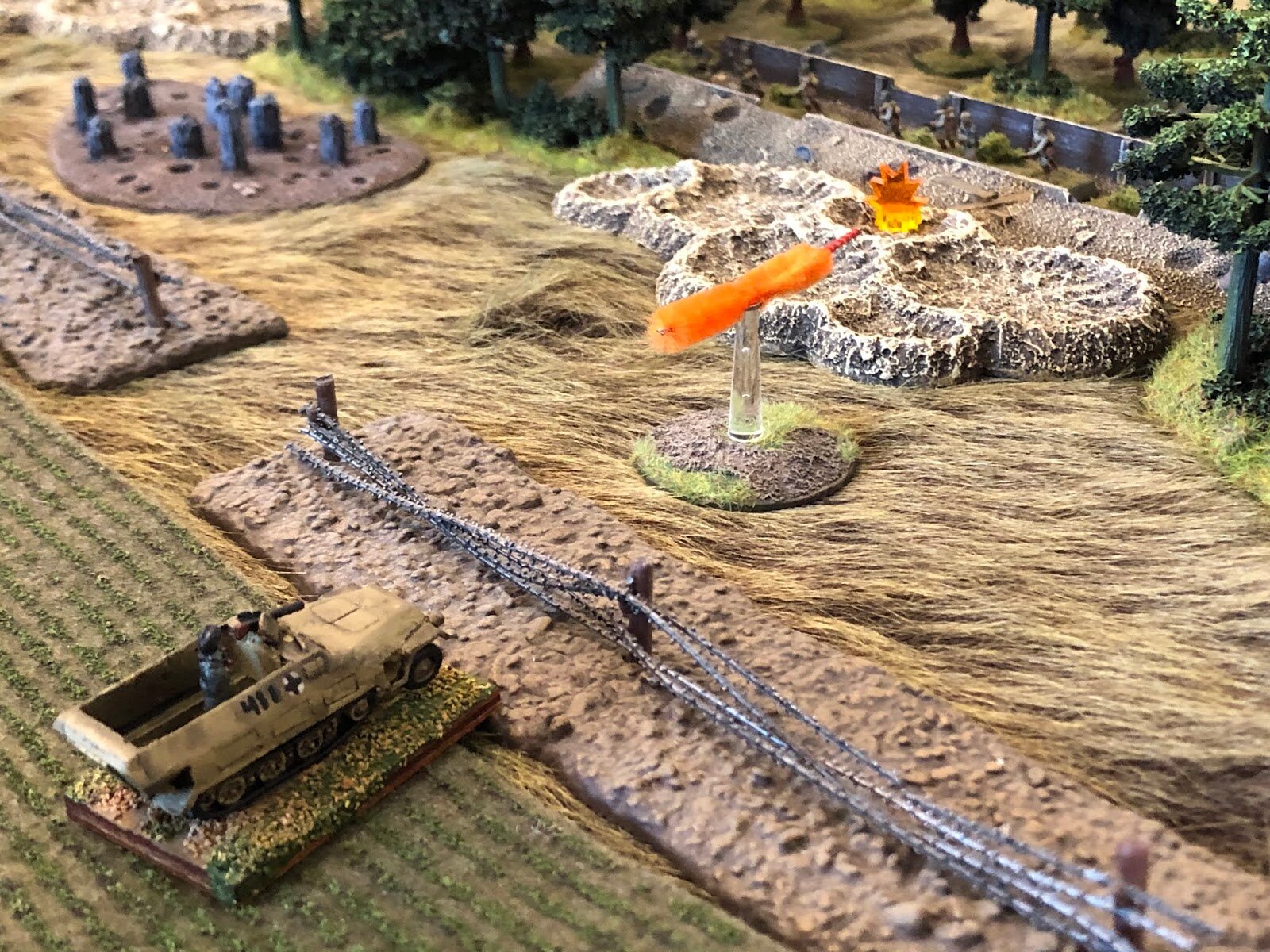  He spots the dug-in enemy infantry and opens fire with his MG-42. 