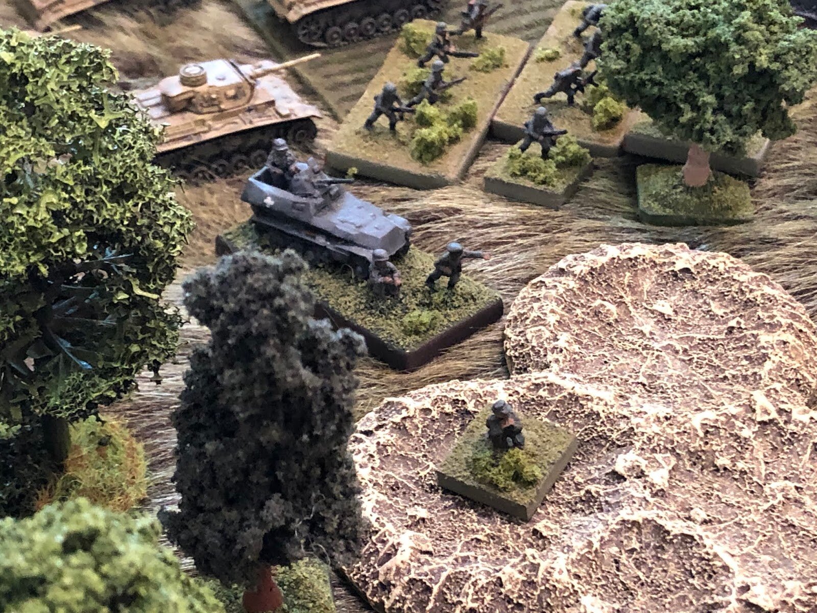  The German commander fires a green flare from his Very Pistol, signaling the start of the attack, with his Mortar Platoon commander in front of him in the craters, tanks and riflemen of 2nd Company behind him. 