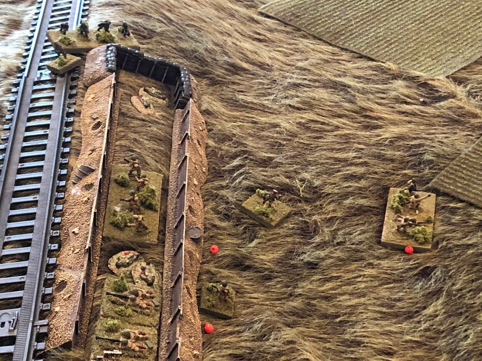  While at the railway embankment, the Soviet platoon commanders do their best to rally their men, with Germans (top left) literally on top of them.  Needless to say, they're having a rough time.   *That's to be expected when you're conscript and have