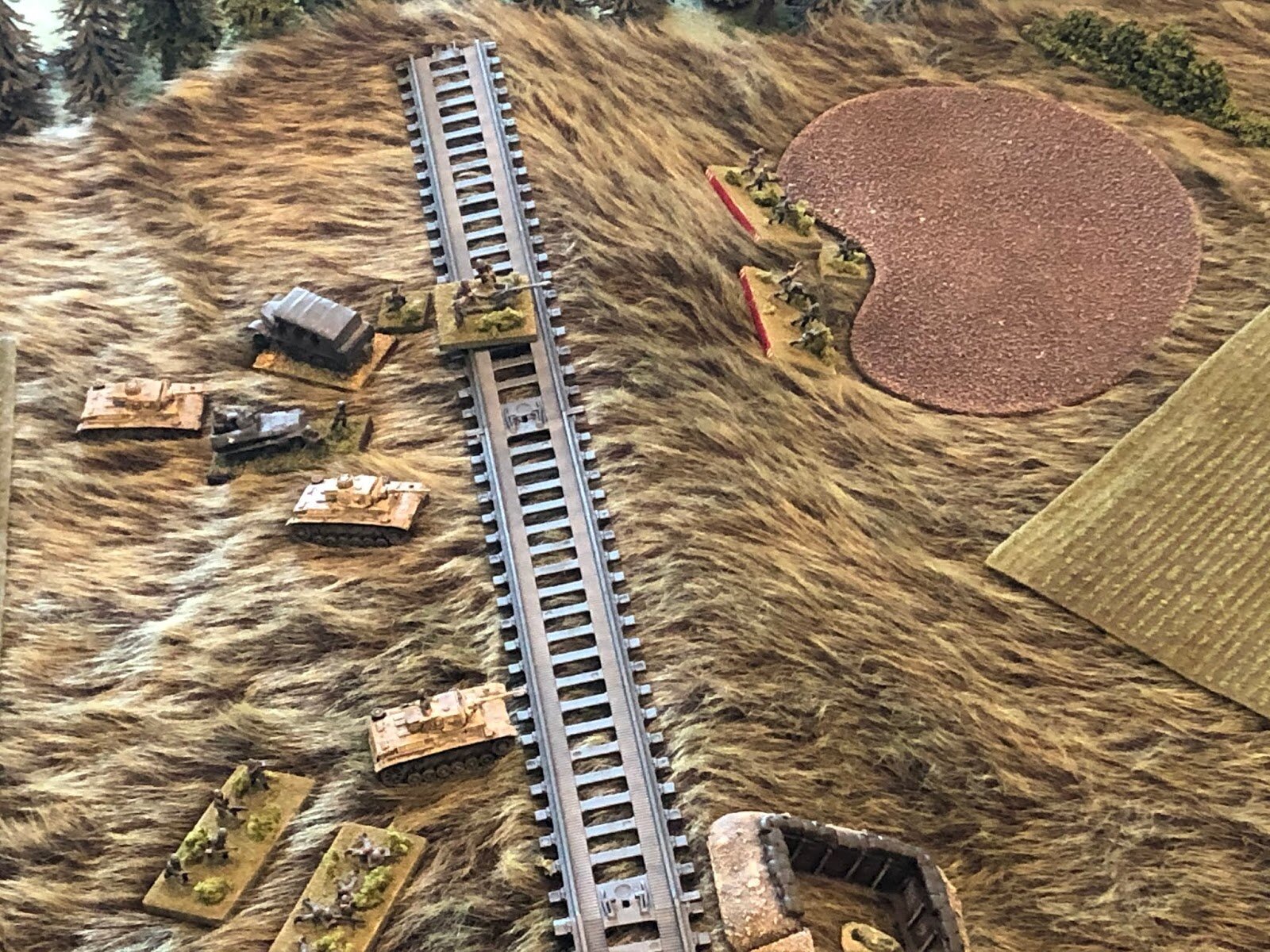  On the German left, with the Soviet tanks (off camera to right) preoccupied with the German tanks (left), the 2nd Plt, 2nd Company, pushes down the east slope of the railway embankment (center top right, from top left).  
