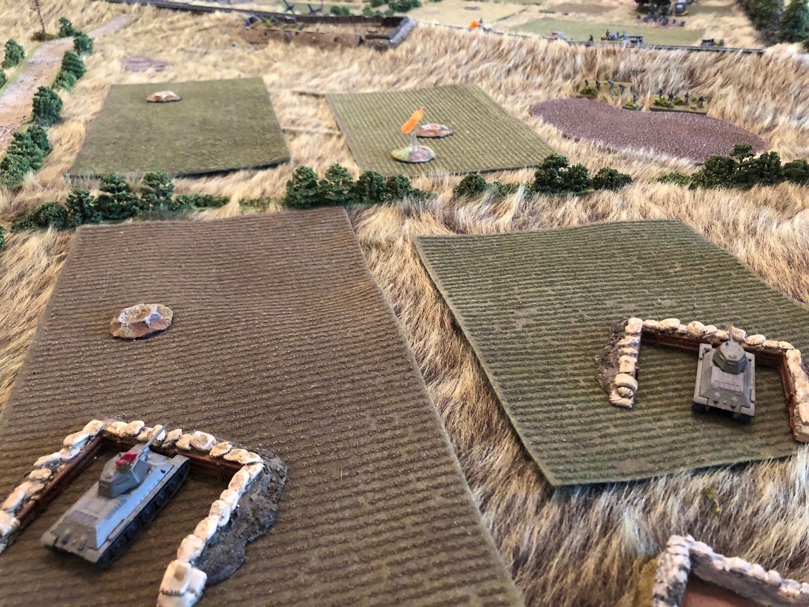  The Soviet tanks continue to engage the hull-down panzers, to no avail.  