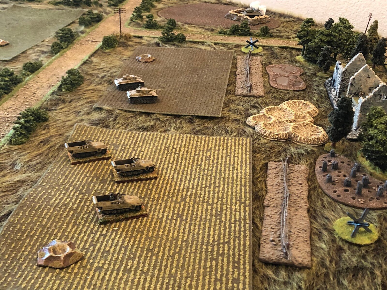  As the panzers and halftracks go in, moving for the Collective Farm. 
