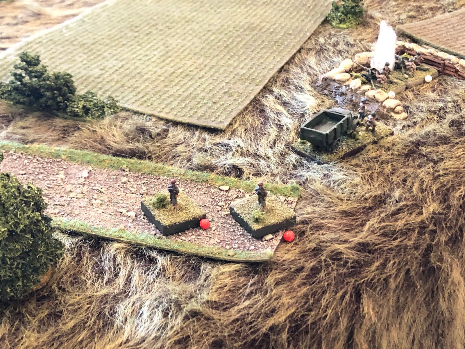 The position is buffeted by high explosive shellbursts and MG rounds (top right), causing both sets of 'elite' crews to abandon their guns, running right past their shocked CO! 