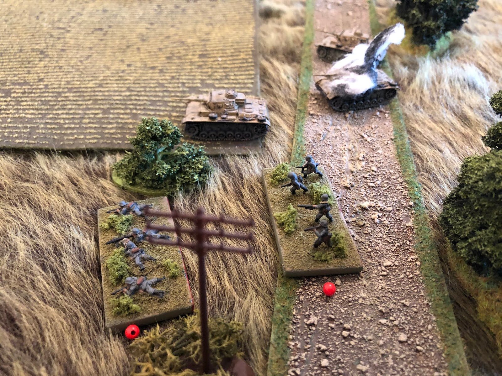 On the German left, the two remaining tanks of 1st Panzer Platoon try to rally the two remaining squads of 1st Plt, 2nd Company, but they're unable to get them up and moving.