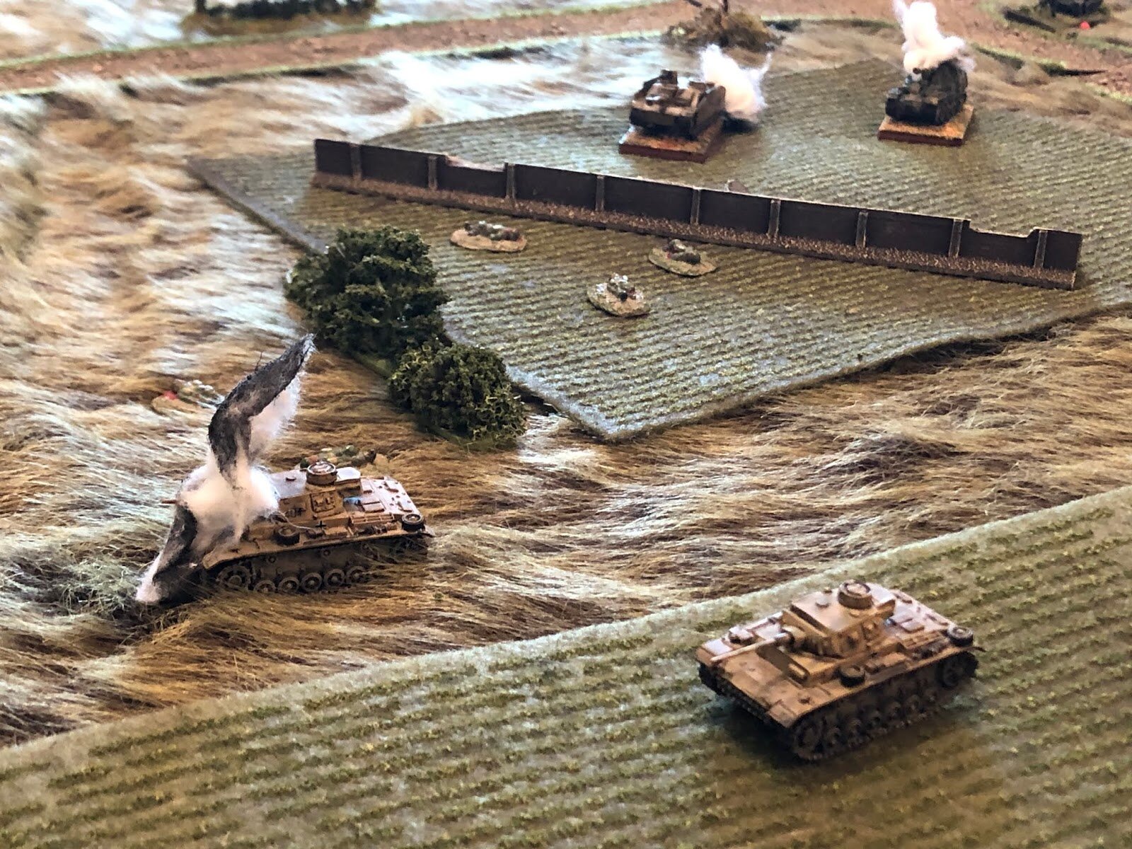BAM!  One of the Panzer IIIs goes up in flames as the other's commander tries to figure out where the hell that came from!  One of the Stugs and the Marder burn in the background.