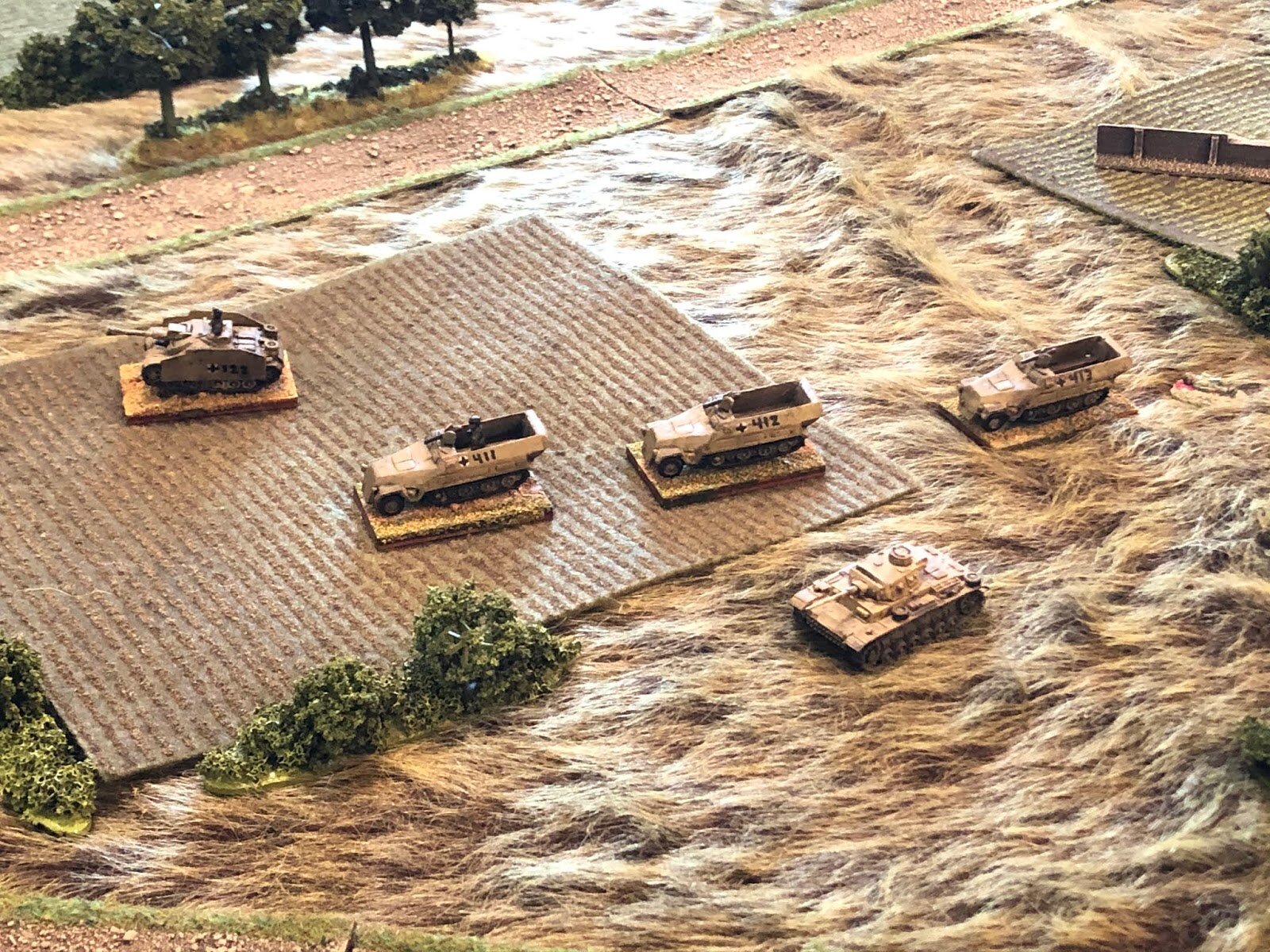 The German armor that had pushed further east realize the gig is up; they dismount, destroy their vehicles, and wait to be captured by the Soviets.