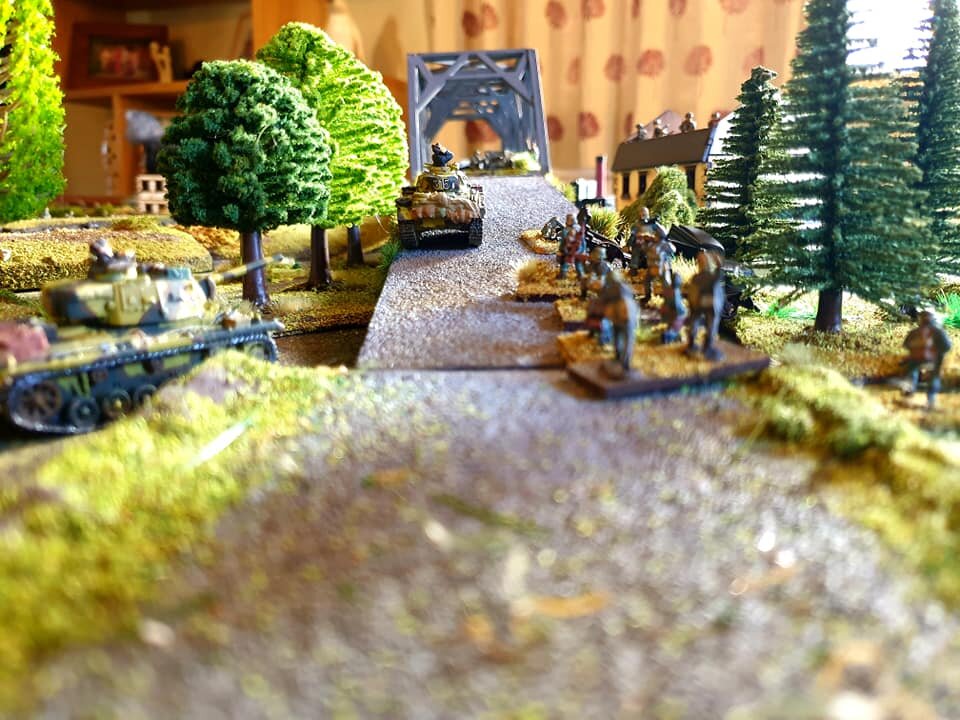 Central thrust gets halted. Lead Panzer III breaks down on the ramp! Artillery pins the accompanying infantry.