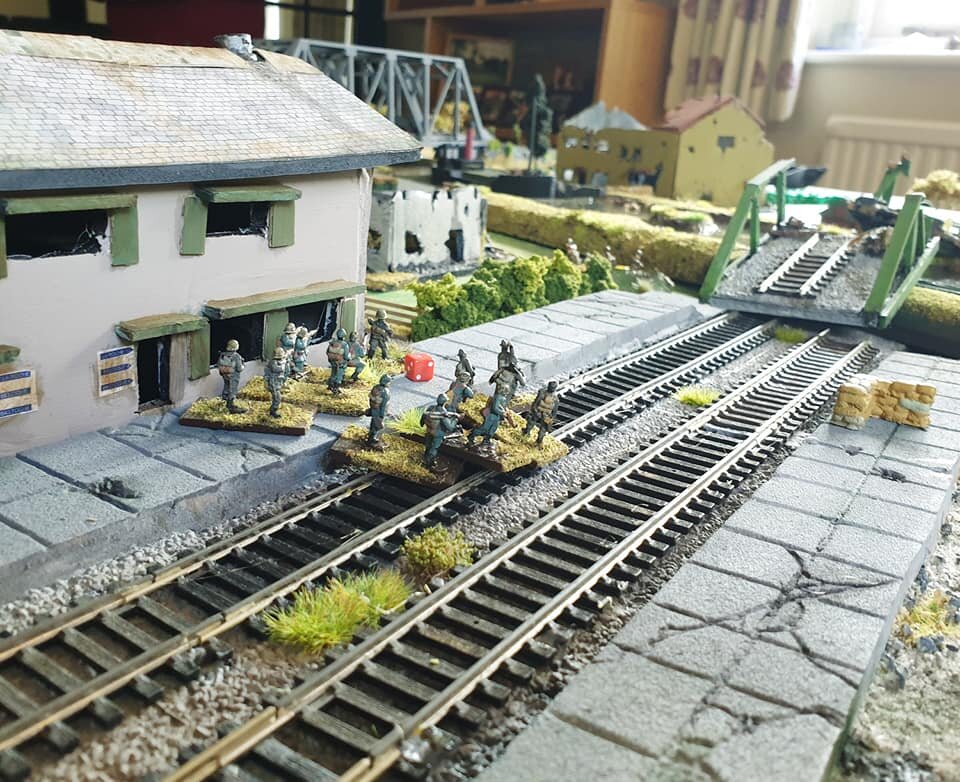 Probing Infantry try sneaking through the Railway station but get spotted.
