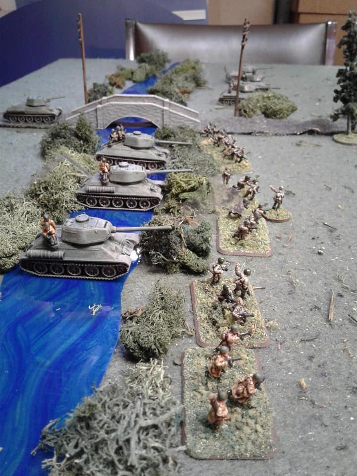 2nd tank platoon and 2nd Rifle platoon both lagging behind. One tank gets bogged in the river.
