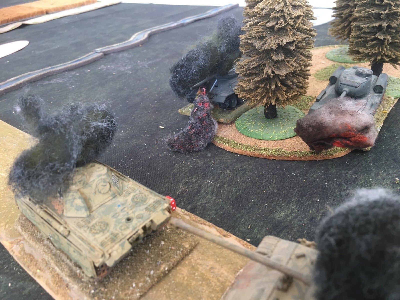 In a final exchange of fire, the lead Panther manages to knock out a T-34 as it in turn is destroyed