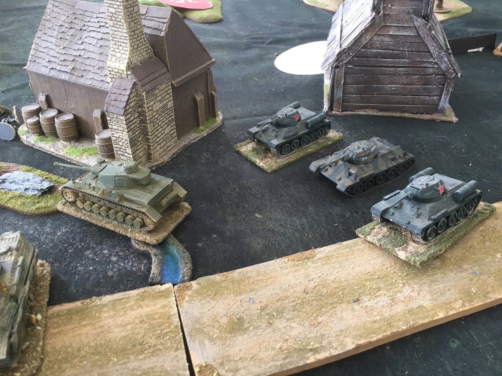 And another three T-34s dash into action just as the Panzers have turned to face the Soviet heavy tank behind them