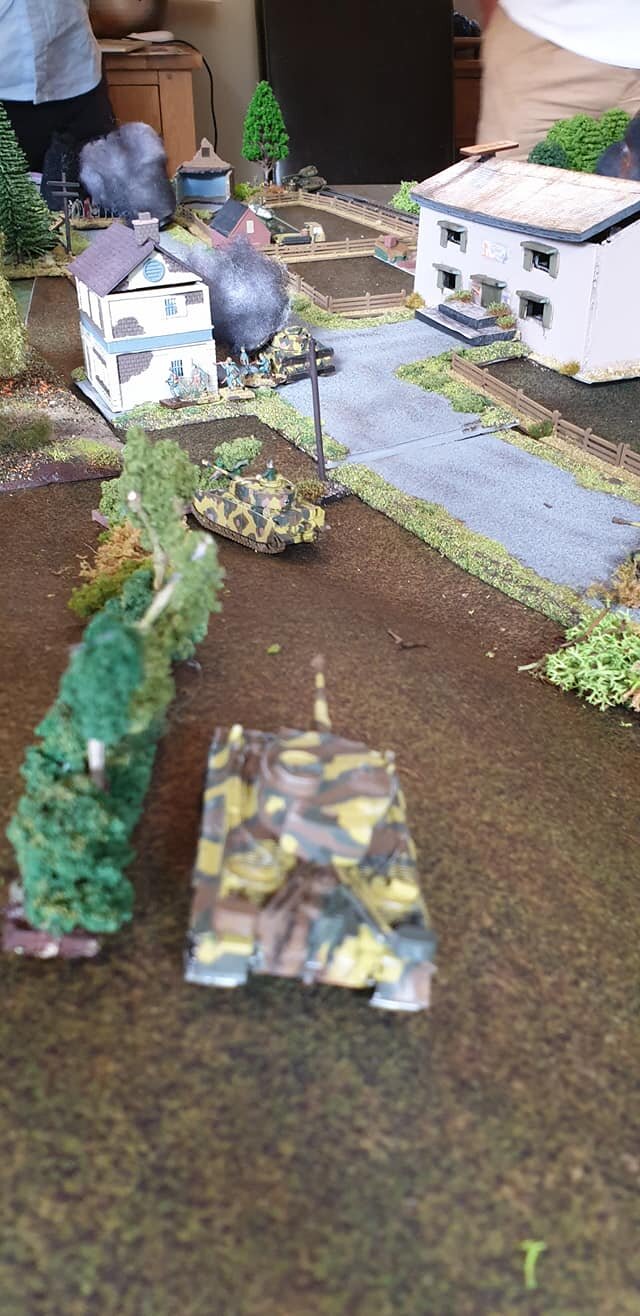 Second Tiger on reverse slope sees Panzer IV brew up below him, enemy have outflanked him.