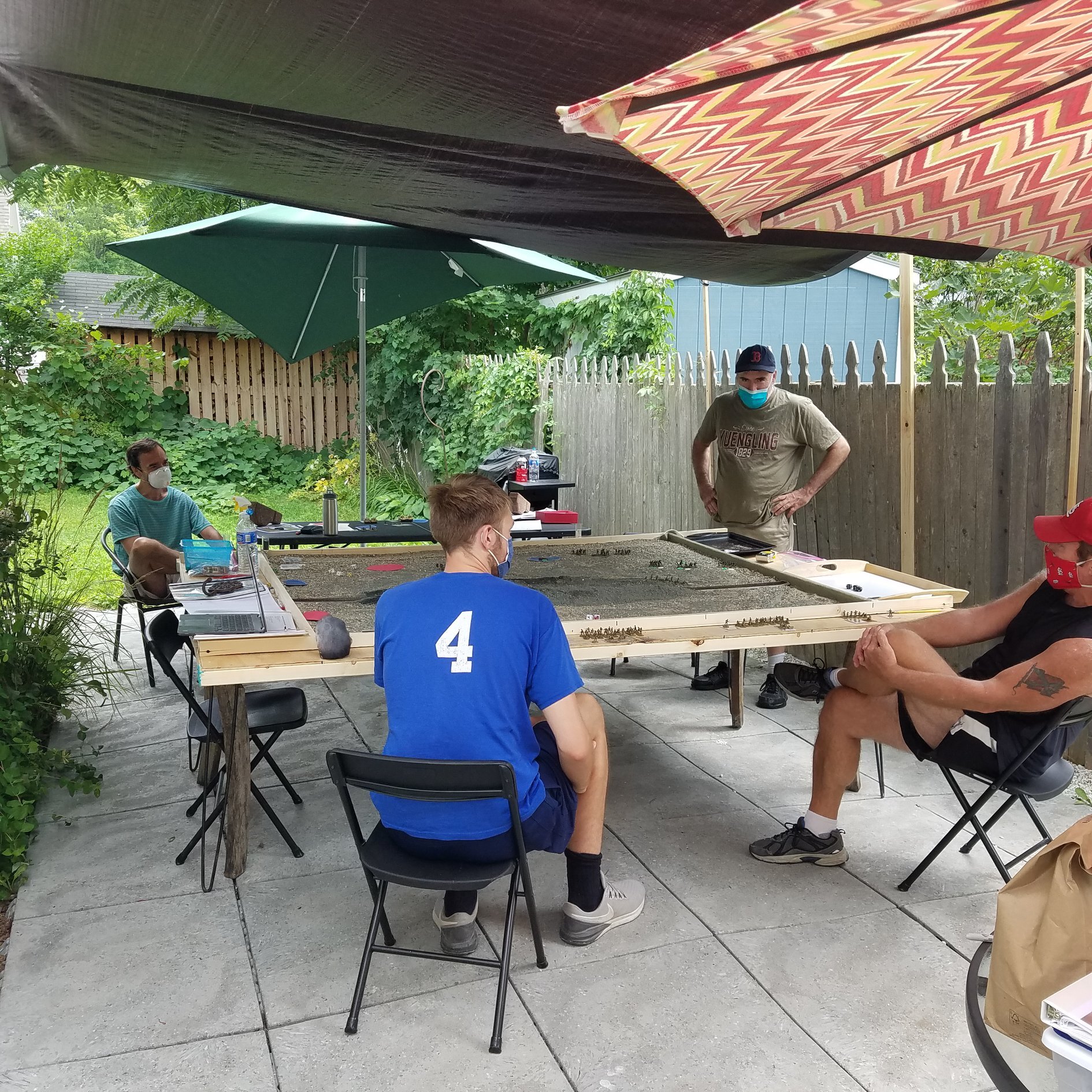 COVID-safe outdoor gaming on the patio of Dan Albrecht with Harry Voelkel, Steve Smith, Steve Emerson and Brett McLay