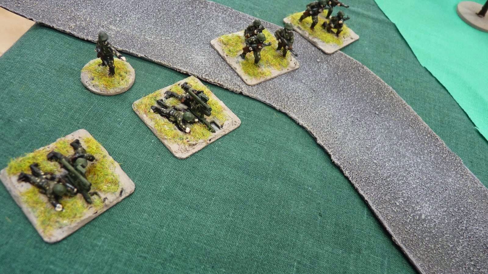 On the extreme north of the table, between the two woods, the Soviet support platoon joined in the battle with the MG section firing on the German infantry as the AT section waited for a target.