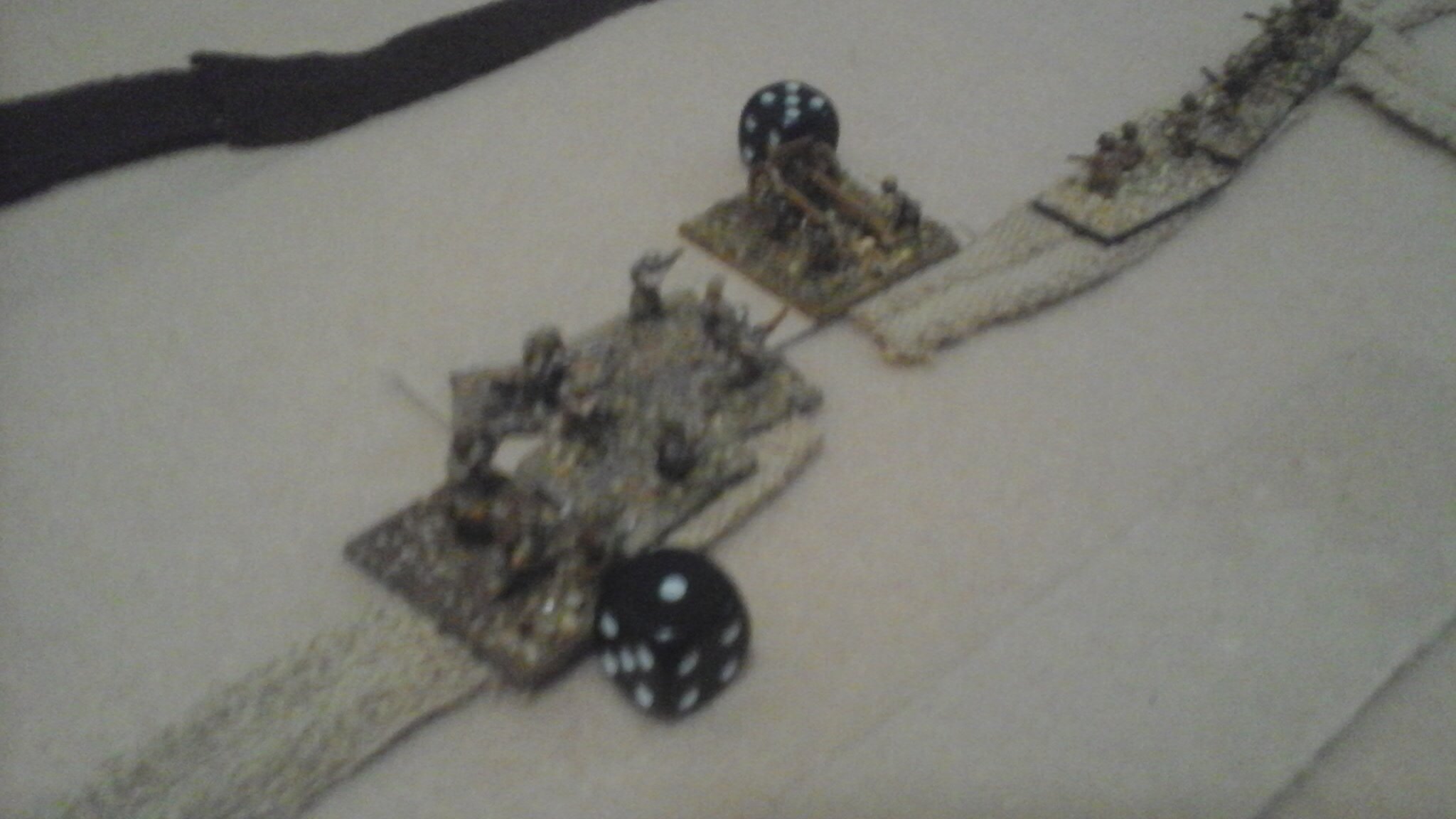Dundee himself breaks into the main Italian defensive dugouts, capturing the MMG and field gun.  