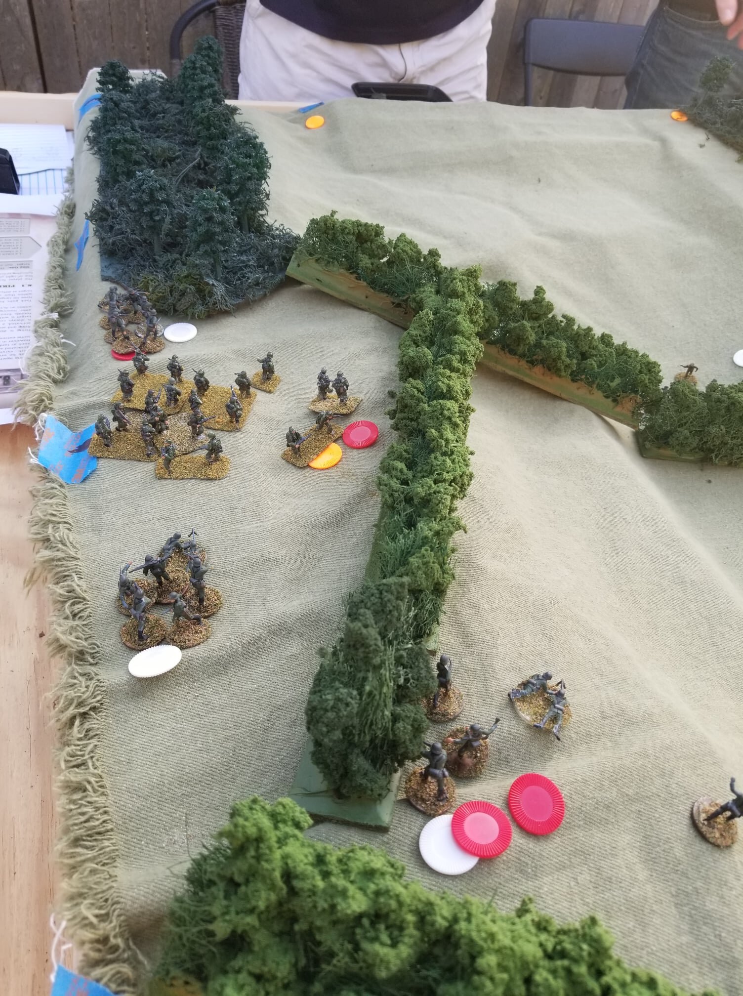  German Panzergrenadiers flood the Polish right flank and gain the cover of the woods. Red chips equals shock, yellow equals suppressed, white equals activated that turn. 