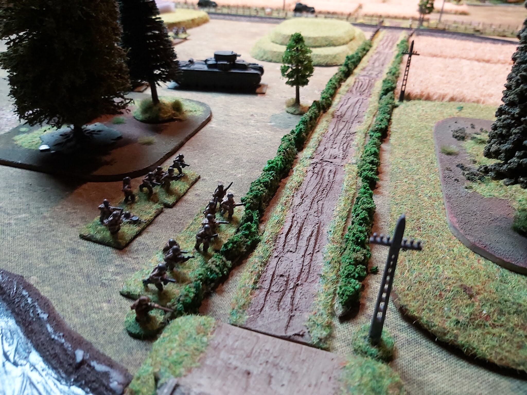 On their right flank they moved into positions by the hedge line whilst the T-35s rumbled forward to support and engage the StuGs. 