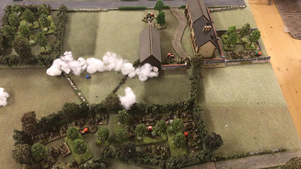  Left to right. Platoon B and A engage the Zug in the farm. The smoke screen just completed this new Turn, so Platoon B is ready to attack the orchard top left. 