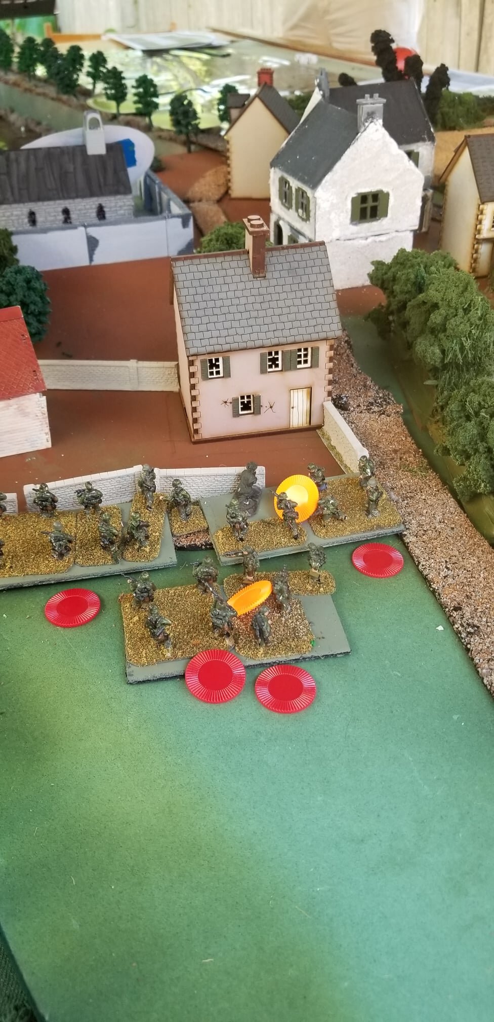 German infantry suffers shock from a US MG firing from a 2nd story window