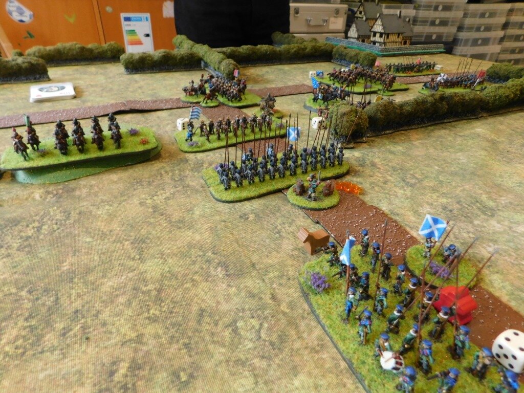 Meanwhile, my Roundheads protect the flank of the infantry facing the Royalist force by sending forward the pike-only boys