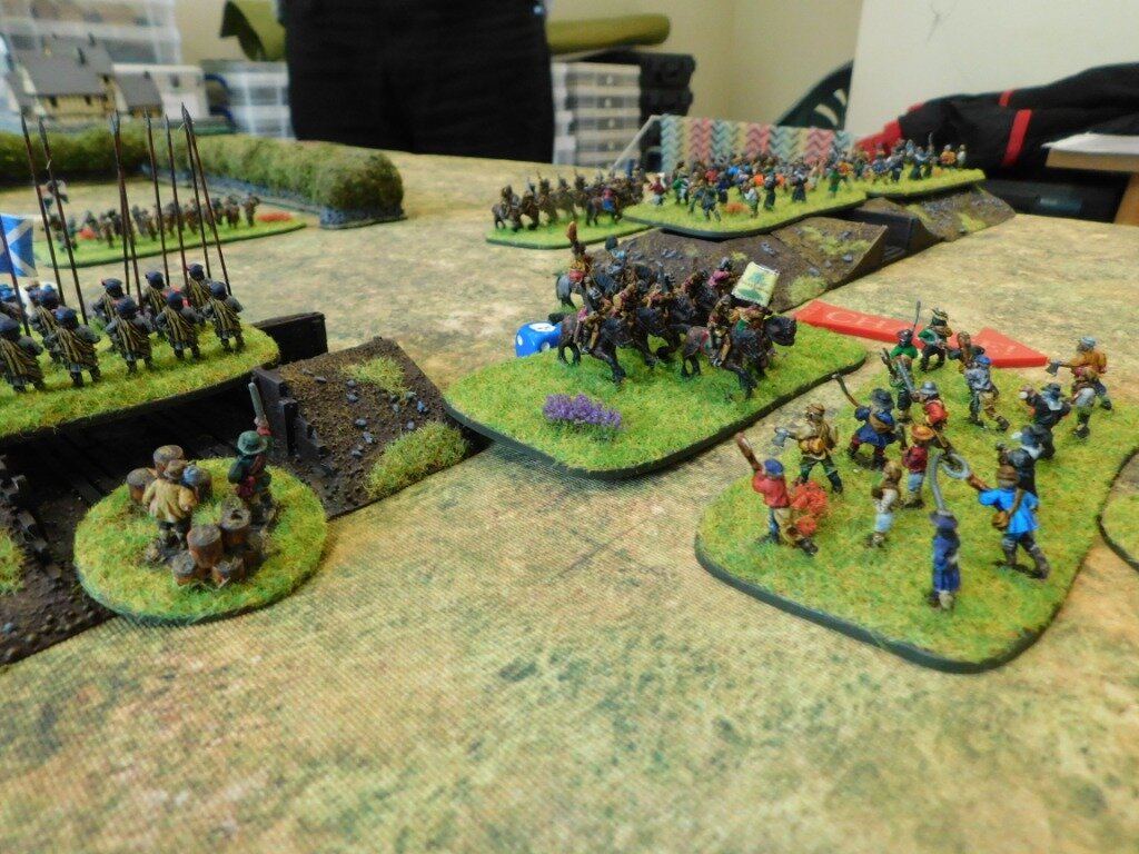 Where the rampart is not complete, the Royalist horse sweep the Roundhead diggers away!