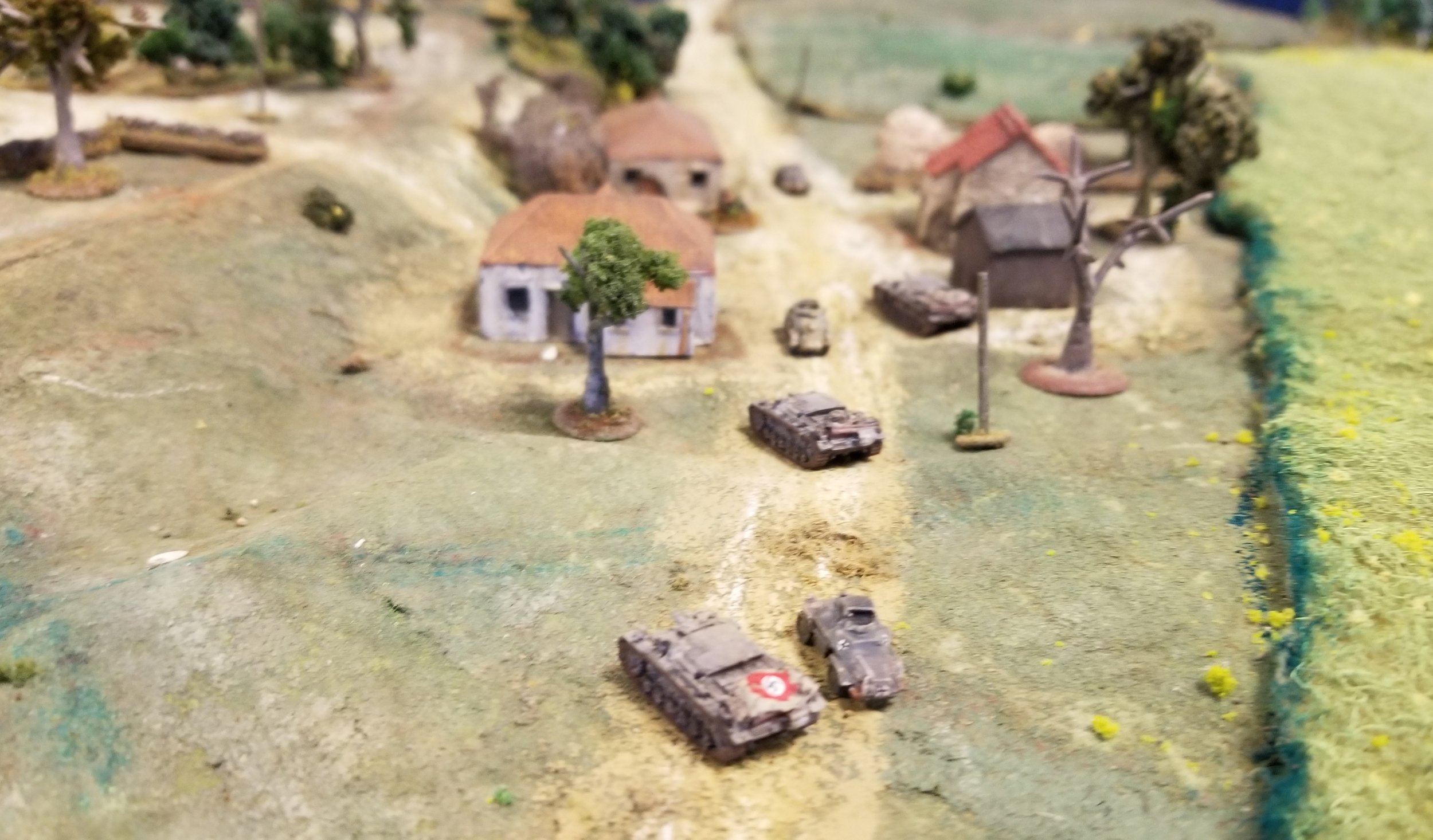 StuGs engage the troops in town