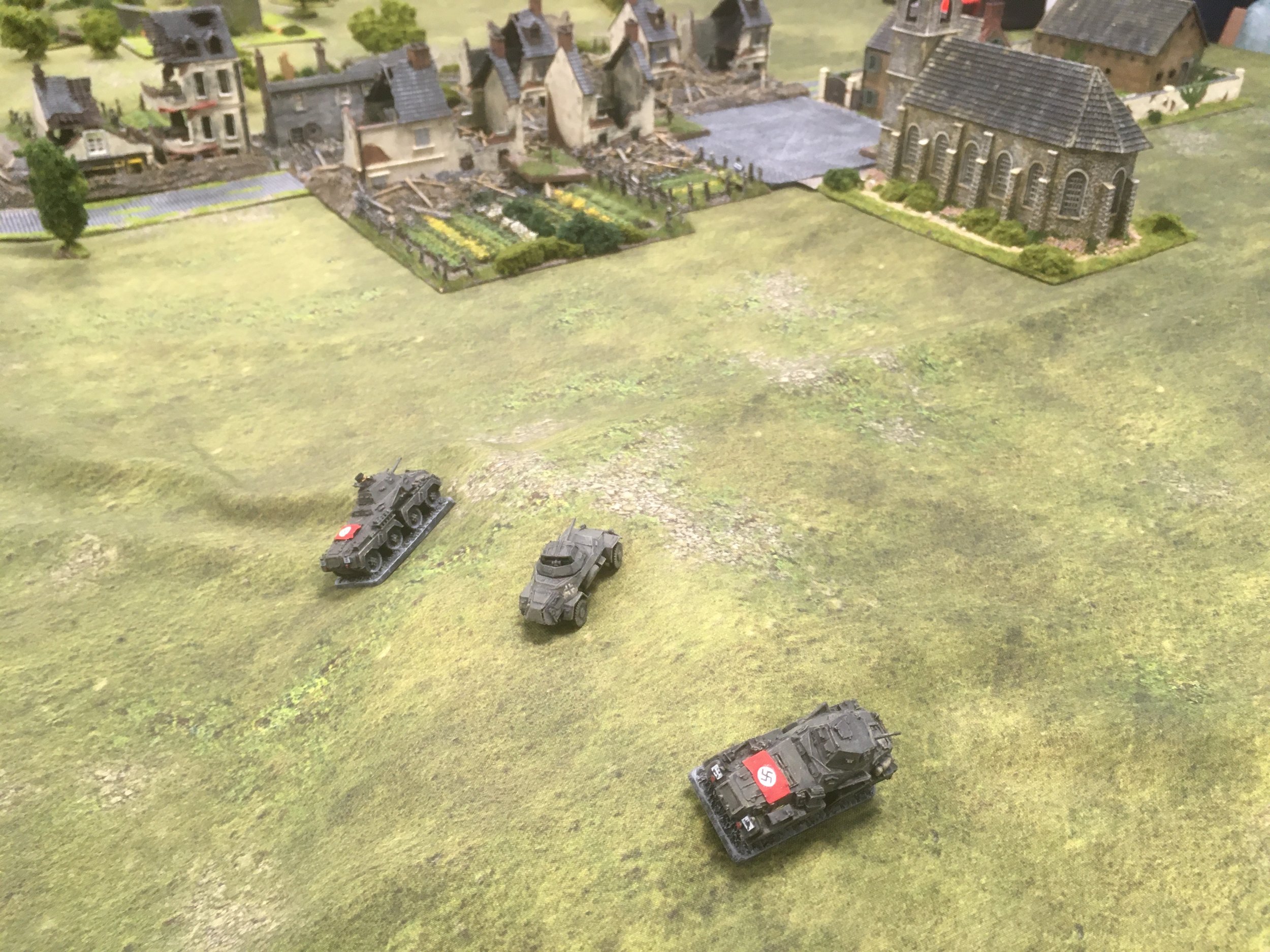 Whilst the armoured cars approach from the German right flank...