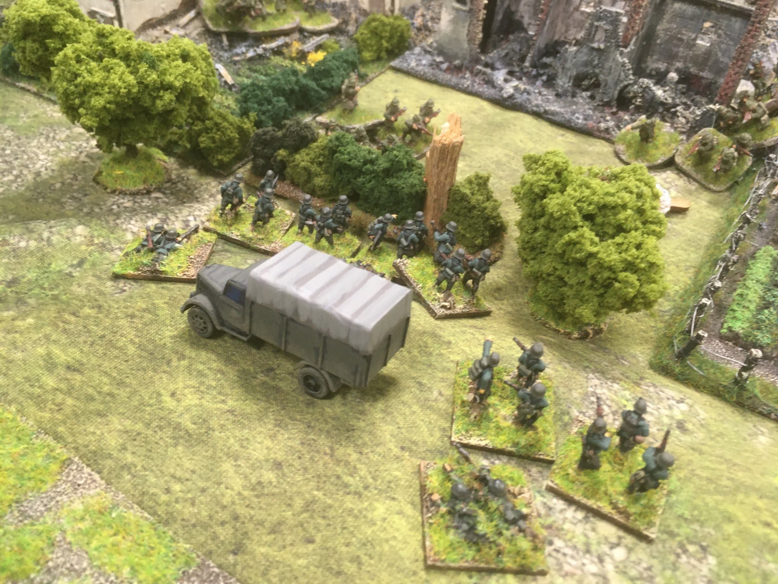 A second platoon embracing the spirit of Blitzkrieg rushes forward and disembarks to take on the survivors of the Panzer IV fire...