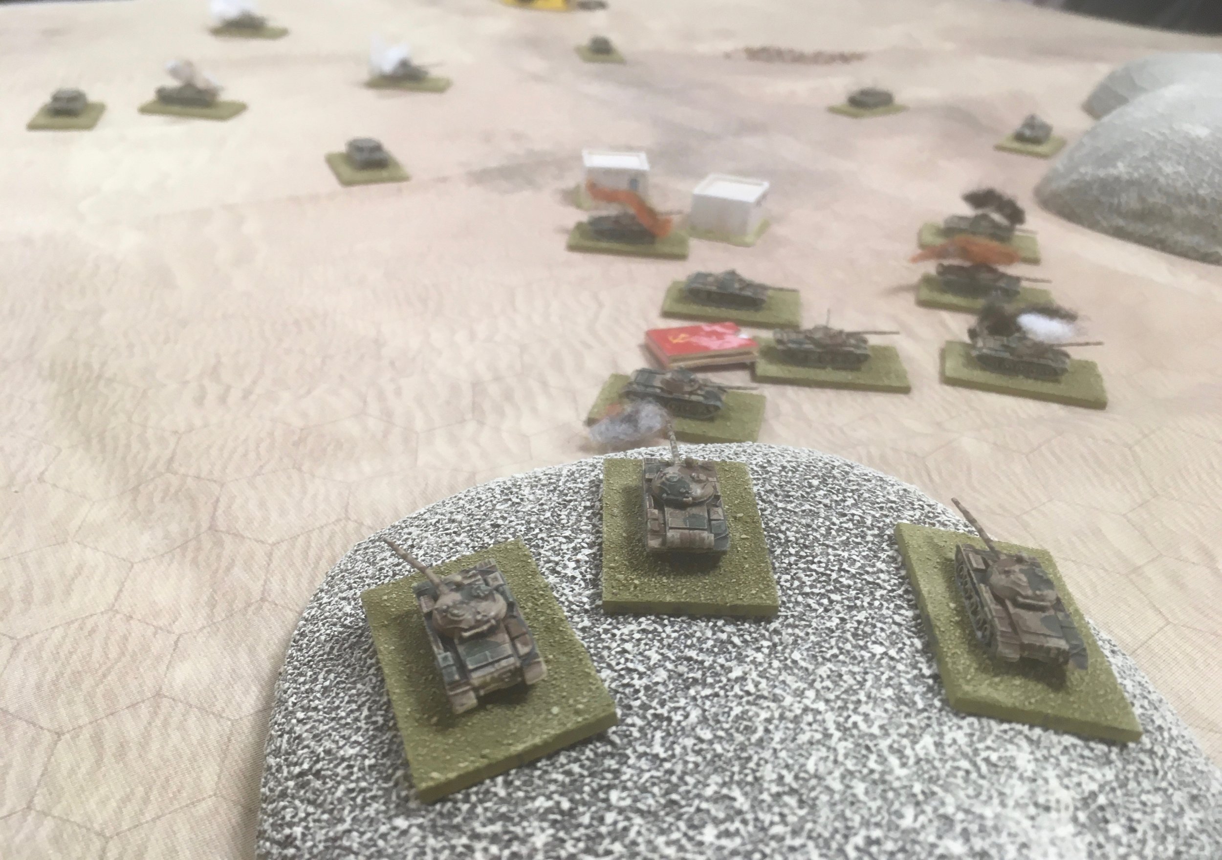 In a vain effort to stem the Israeli tide, the surviving T-62 platoon on the hill opened fire on the advancing Sho't's...