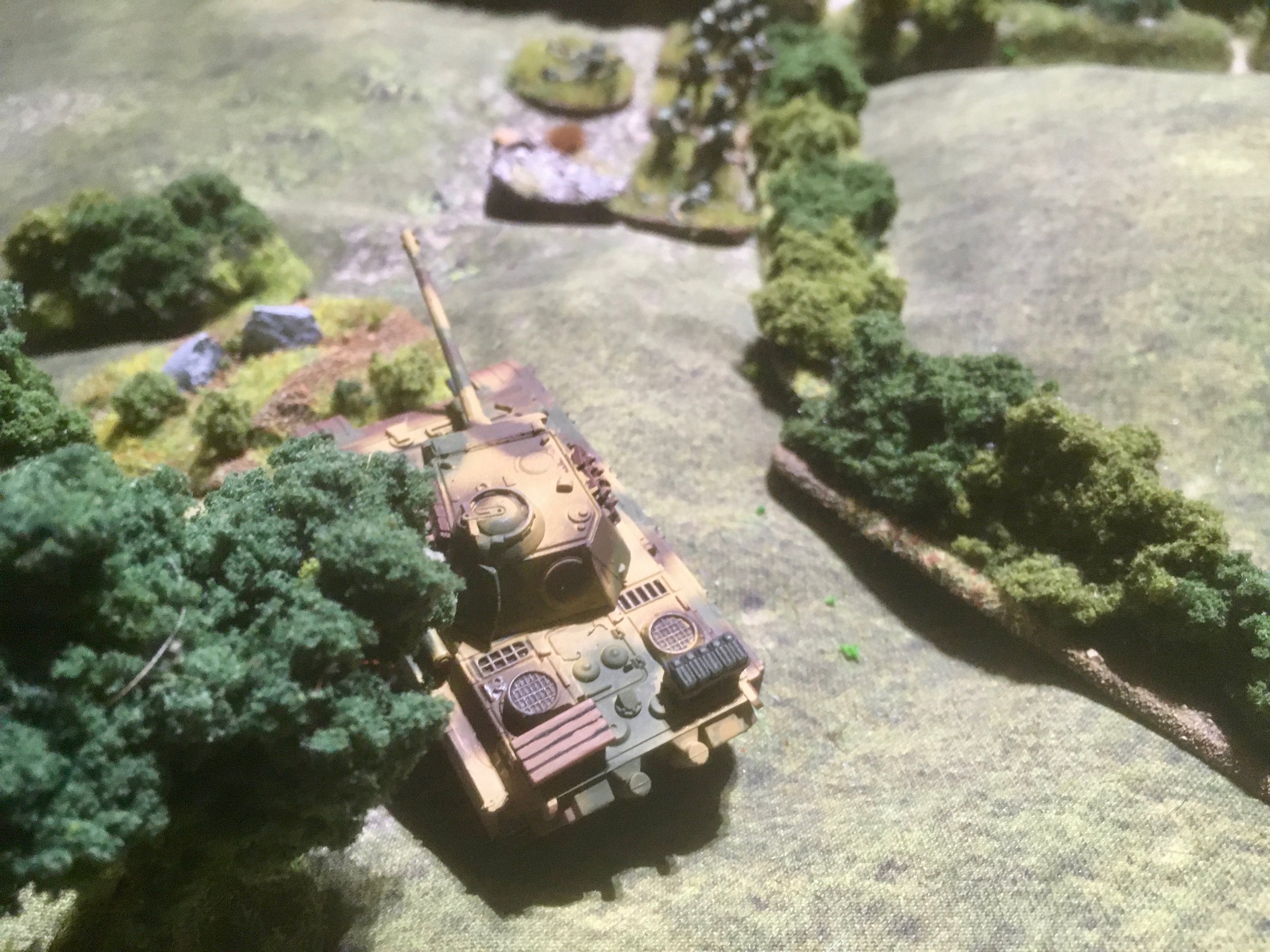 Utilising its speed, the Panther on the left pushed forward into the flank of the British troops entrenched behind the hedgerow.