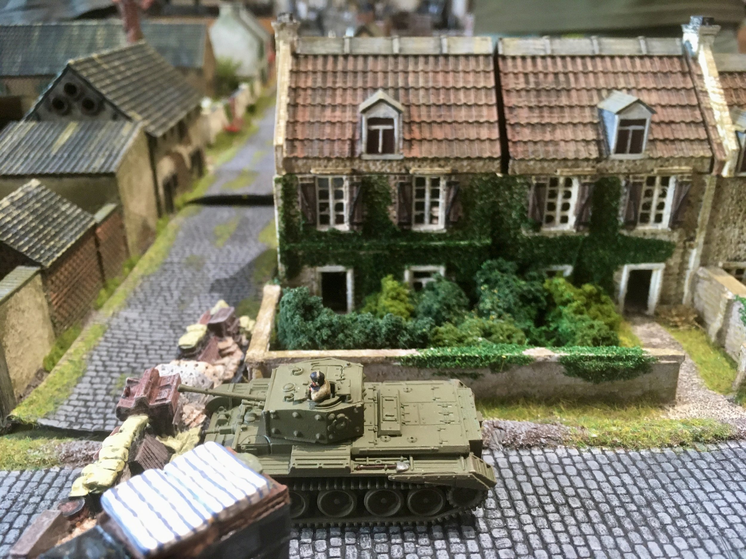 With the road to the railway bridge seemingly open, the Welsh Guards turned their attention to the route to the road bridge, only to be confronted by a barricade. 